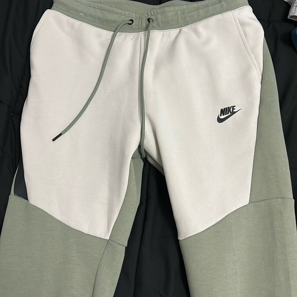 Light green and tan Nike tech pants